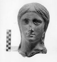 testa votiva femminile