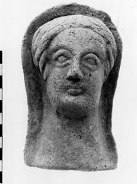 testa maschile votiva