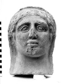 testa maschile votiva