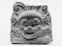 Antefissa con palmetta e maschera comica