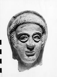 testa maschile votiva