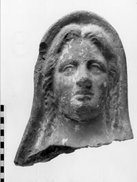 testa femminile votiva