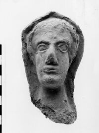 testa maschile votiva