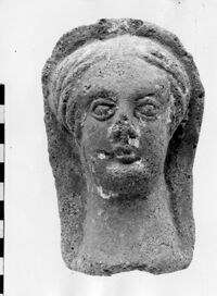 testa maschile votiva