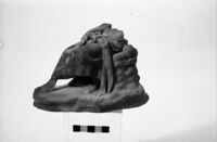 Statuetta maschile seduta