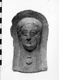 testa maschile votiva