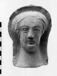 testa maschile votiva