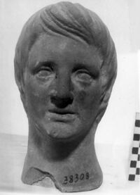 testa maschile votiva