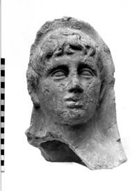 testa maschile votiva