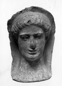 testa maschile votiva