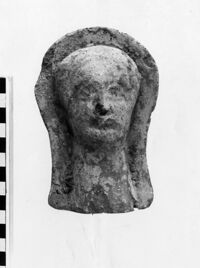 testa maschile votiva