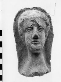 testa maschile votiva