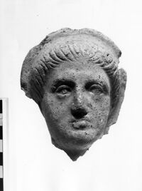 testa maschile votiva