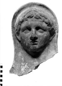 testa maschile votiva