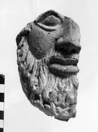 testa maschile votiva