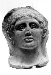 testa maschile votiva