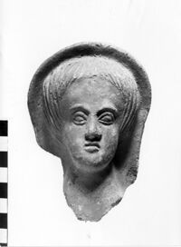 testa maschile votiva