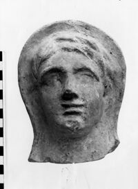 testa maschile votiva