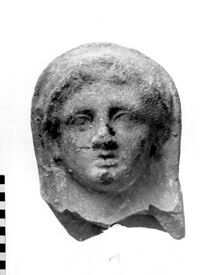 testa maschile votiva