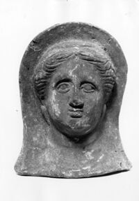 testa femminile votiva