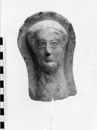 testa maschile votiva