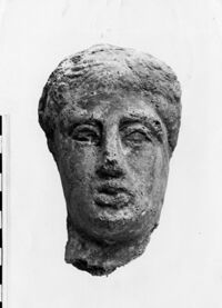 testa maschile votiva