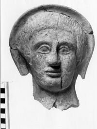 testa maschile votiva