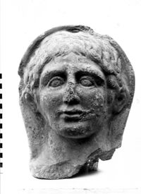 testa maschile votiva