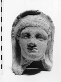 testa maschile votiva