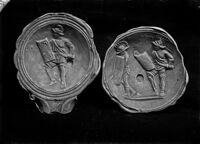 Lucerna con figurazioni di gladiatori